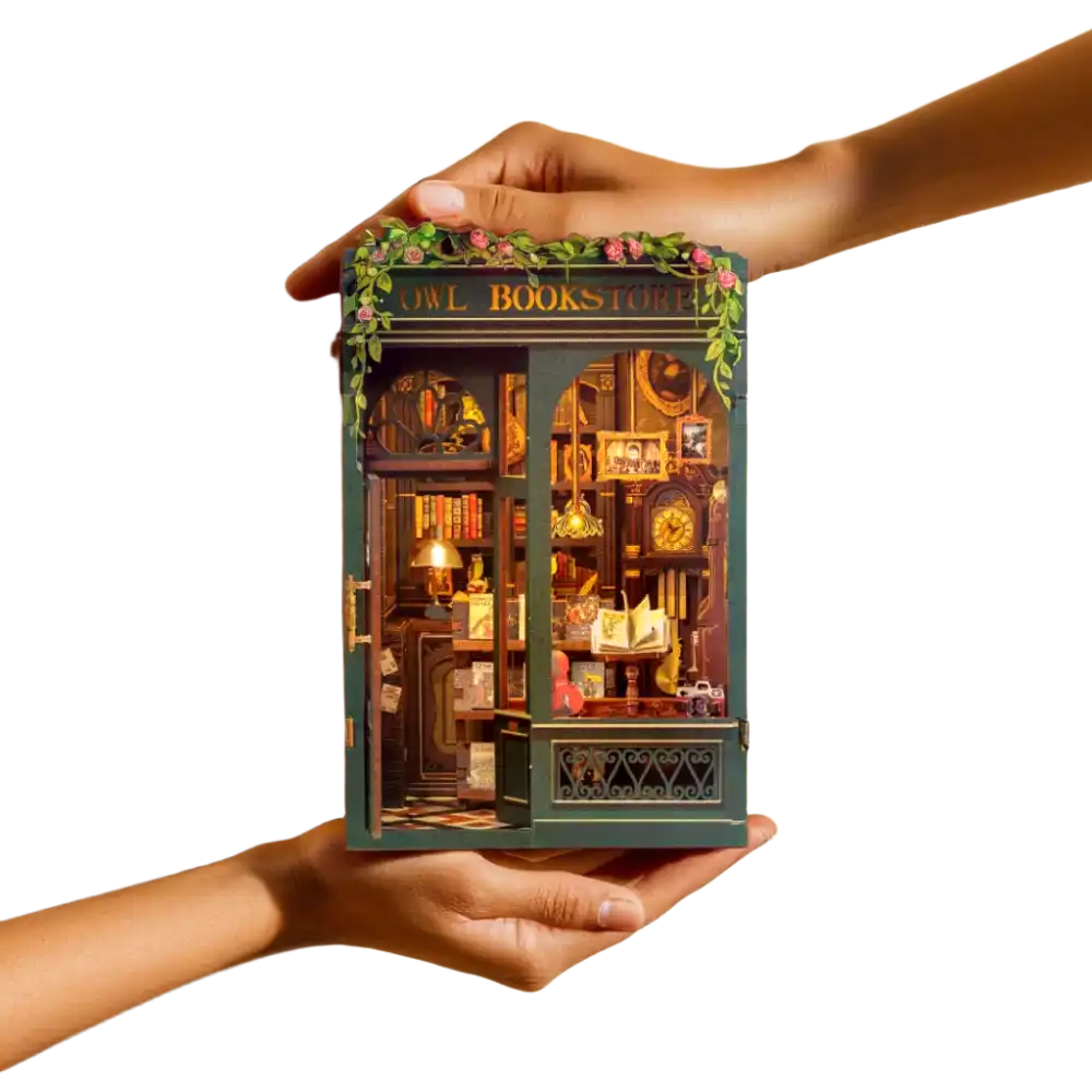 miniature librairie book nook detenu deux mains · Nookora